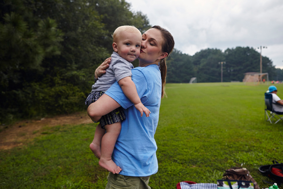Casey Shehi hugging her infant son James.