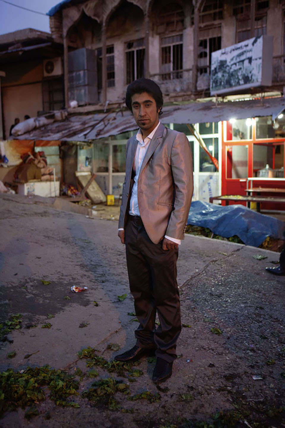 In the central Erbil market as the day ends, a man stands all dressed up with nowhere to go. Although great gains have been made in the new, semi-independent Kurdistan since 2003, there is still a long way to go in developing the infrastructure, both economic and social, to secure the autonomy and success of the Kurdish state.