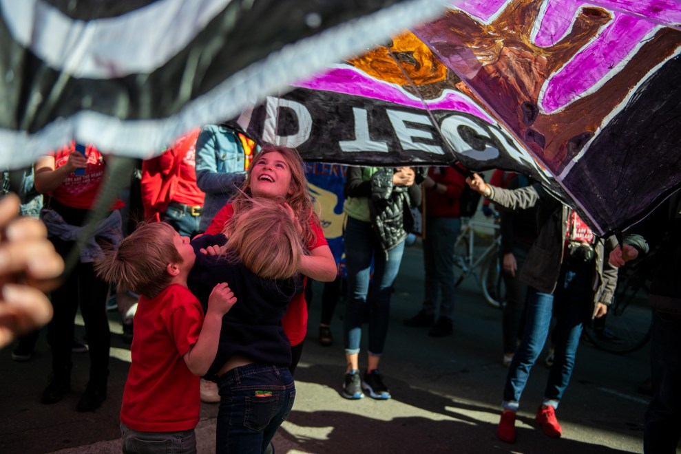 Children played under parachutes as the march made its way along Broadway.