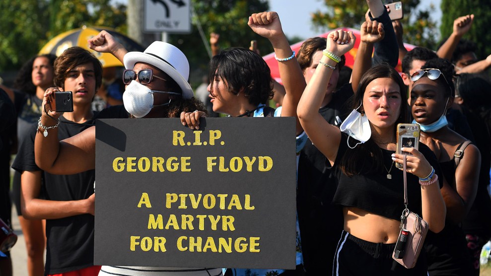 Mourners watch the funeral procession of George Floyd in Houston on June 9.