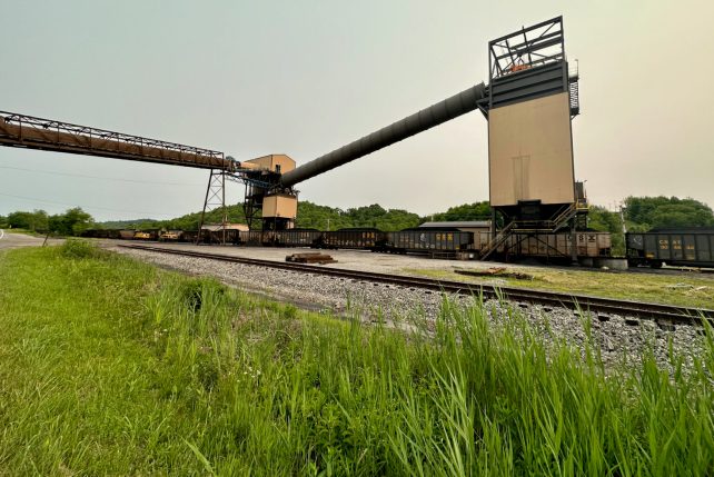 A photo of a dark brown train 