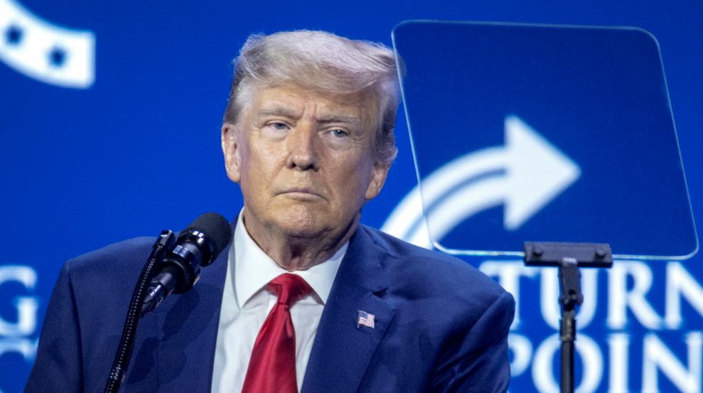 Trump appears pale as he looks at a teleprompter while speaking at the Turning Point Action Conference.