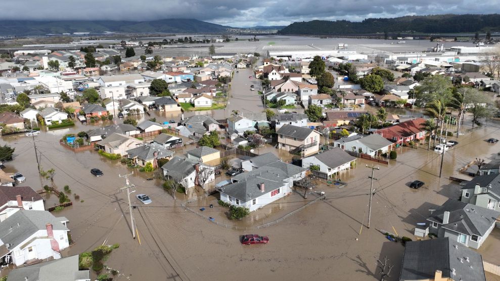 - This aerial photograp shows vehicles and homes engulfed by floodwaters in Pajaro, California on Saturday, March 11, 2023.