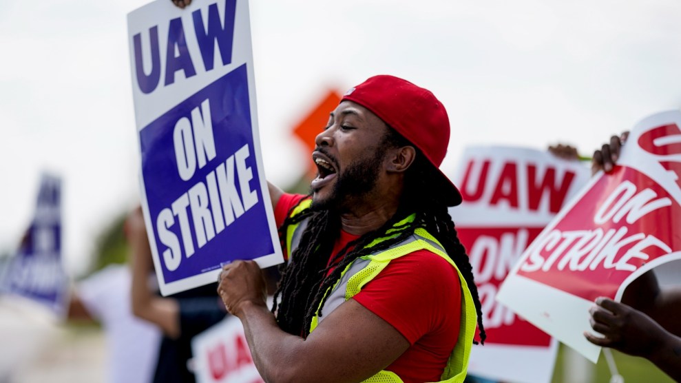 United Auto Workers members picket near a Stellantis parts-distribution center.