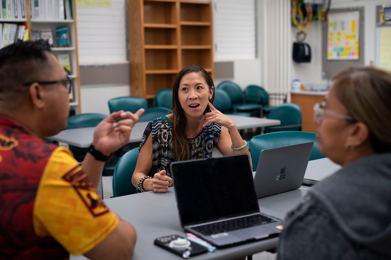 Dr Christina Keaulana meets with Education Assistants Maria Manandic and David DeMotto at Nanakuli Elementary School.