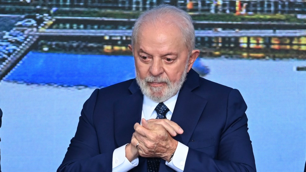 President Luiz Inacio Lula da Silva wearing a blue suit and looking down