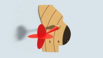 An illustration of a cardboard cutout shape of a pregnant person. The shape of the pregnant person has been cut from a dartboard pattern. And a red dart with a gold tip pierces the belly.