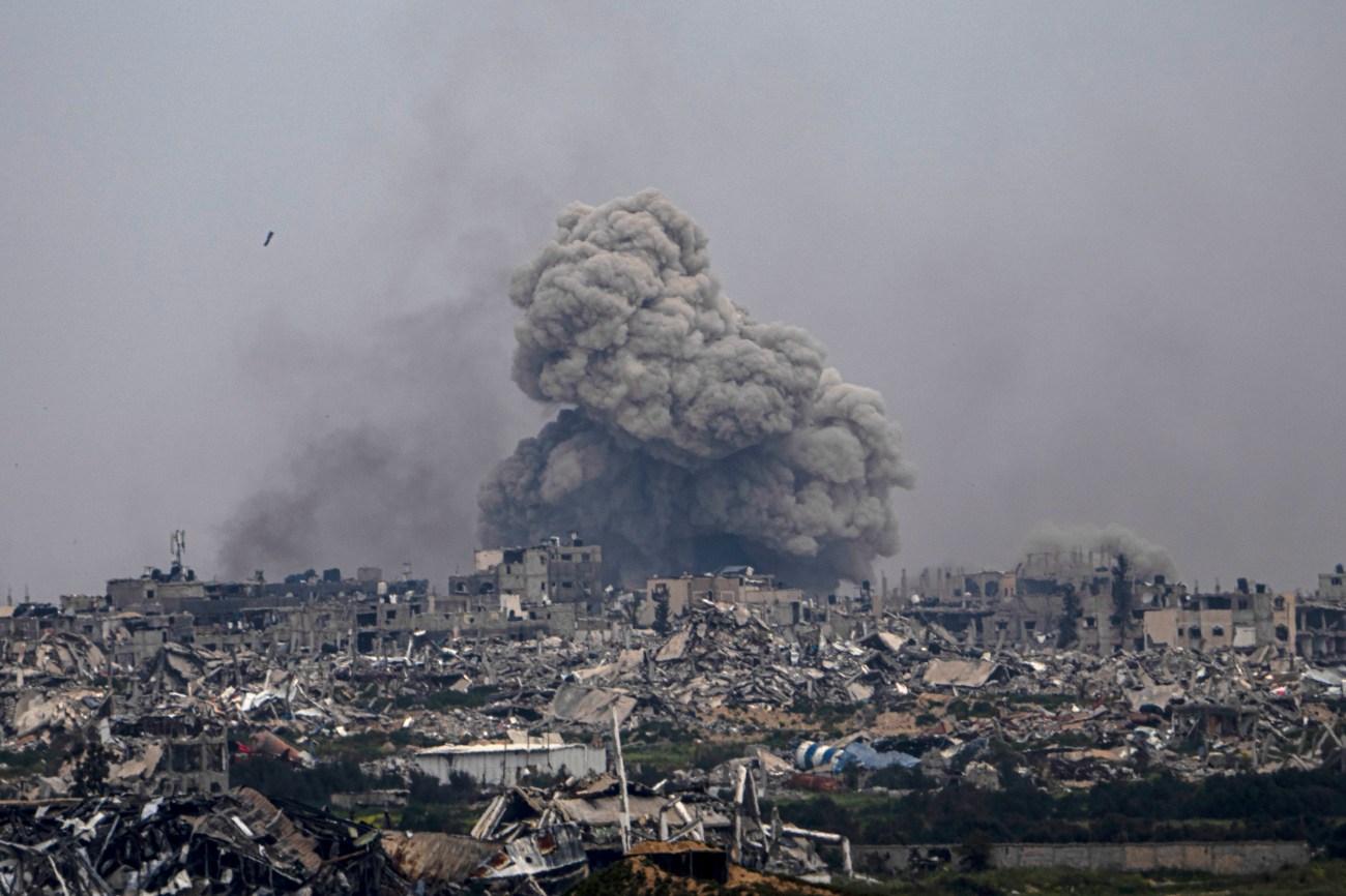 Smoke from a bomb billowing in the distance.