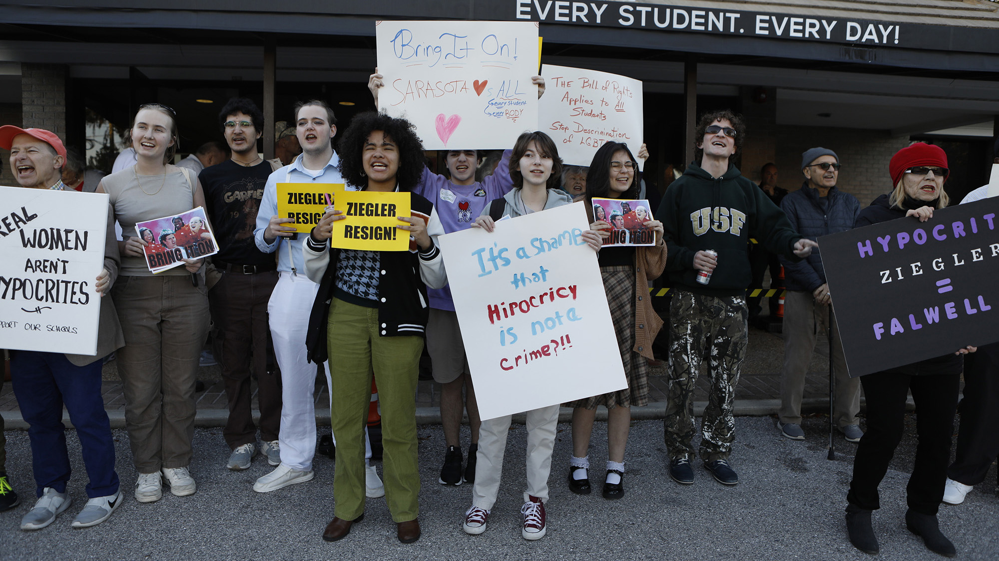 People holding protest signs.