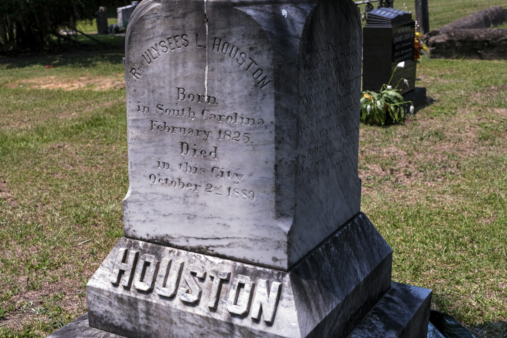 A tombstone in a cemetery.