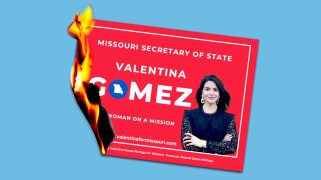 A Valentina Gomez campaign sign that has caught aflame.