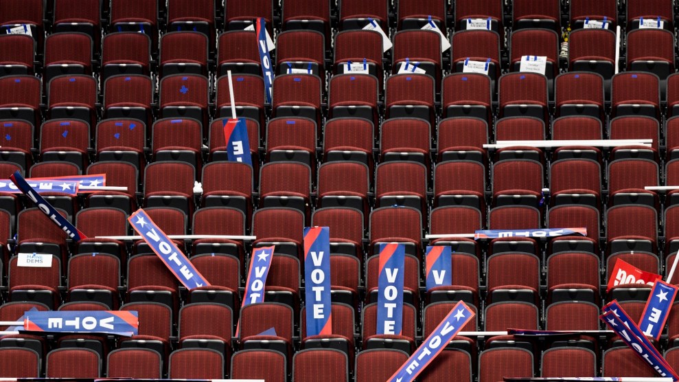 Vote signs scattered on red stadium chairs