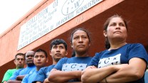 A photo of the staff of the Coalition of Immokalee Workers. looking off to the side