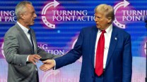 Robert F. Kennedy Jr. on the left, about to shake hands with Donald Trump onstage during a campaign rally