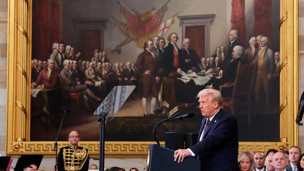 Donald Trump speaks in front of a painting of the Founding Fathers