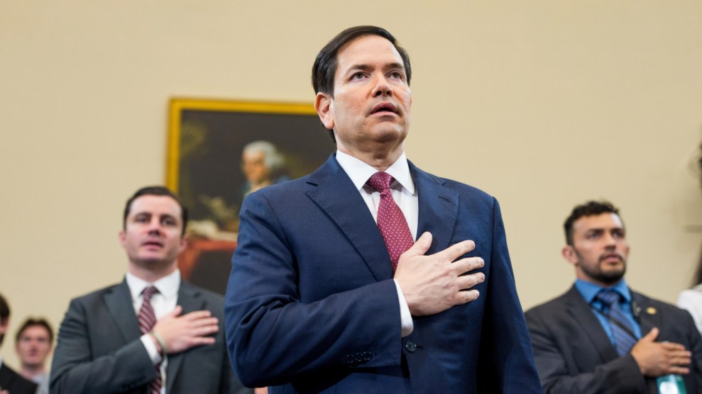 Marco Rubio, US Secretary of State, stands for the pledge of allegiance during a House Committee on Foreign Affairs Committee.