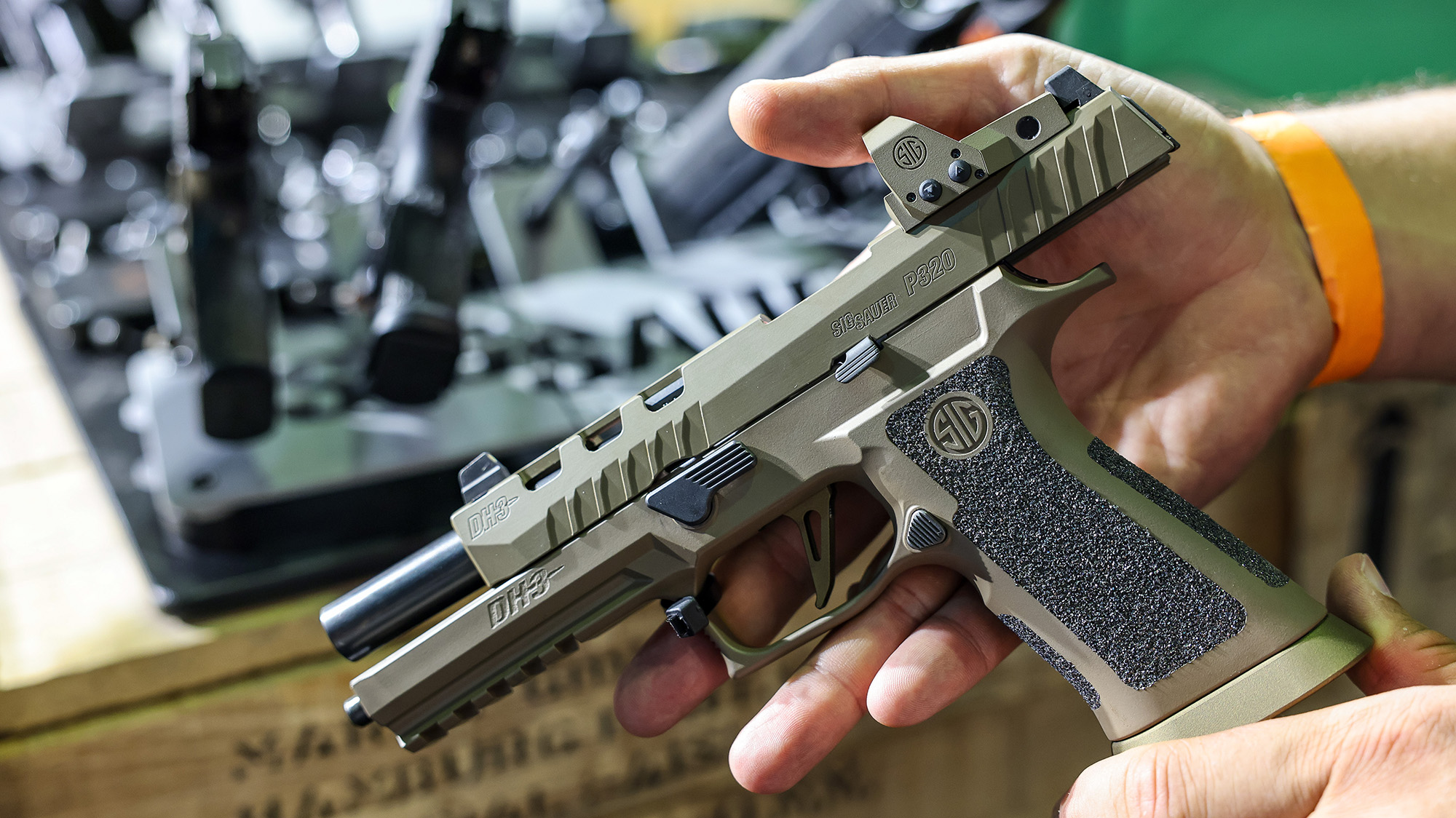 Person holding a gun.