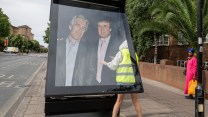 Activists put up a poster showing President Donald Trump and Jeffrey Epstein near the US Embassy in London.