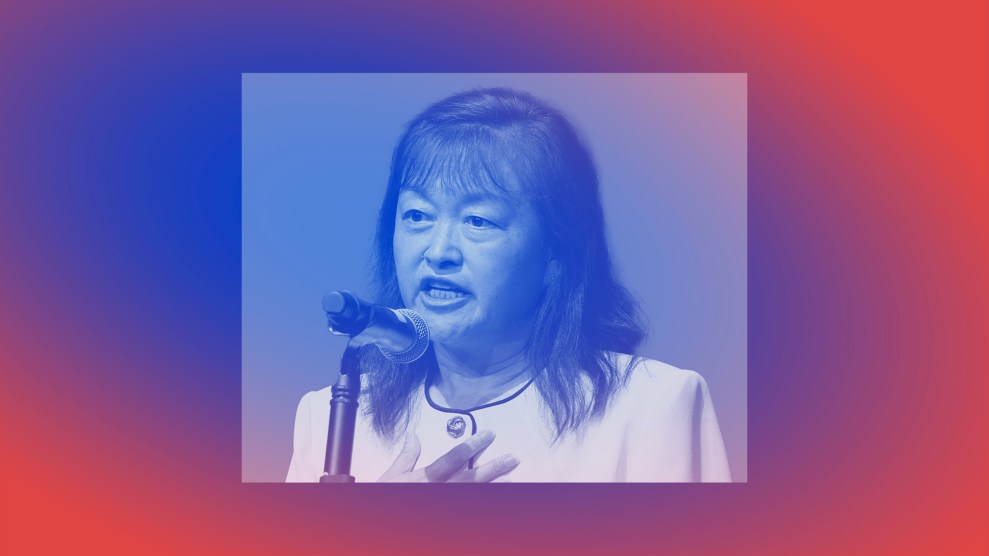 Treated portrait of Lily Tang Williams— a middle-aged Asian woman wearing professional attire and speaking into a microphone.
