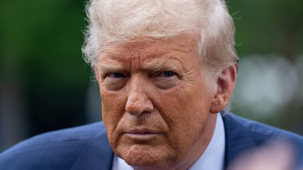 President Donald Trump standing outside and looking angrily and directly into a camera.