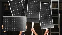 A photo illustration of a crowd of protestors holding solar panels instead of protest signs