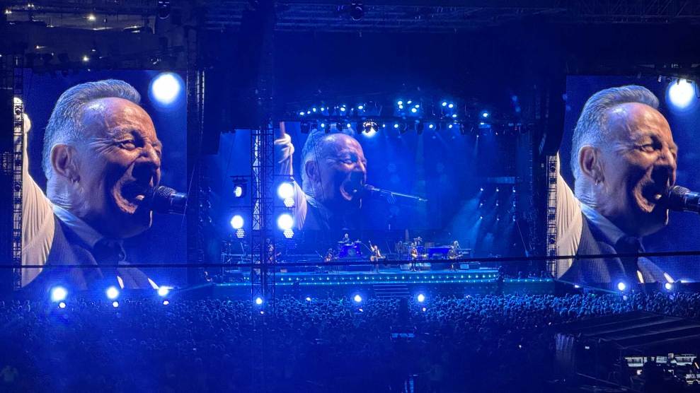 Bruce Springsteen pictured on Jumbotron screens at a concert.
