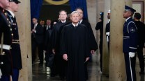John Roberts walks through the U.S. Capitol. Justices Samuel Alito, Brett Kavanaugh, and Clarence Thomas walk behind him.