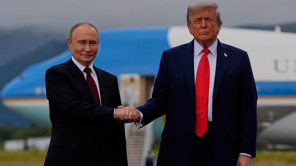 Donald Trump and Vladimir Putin shake hands