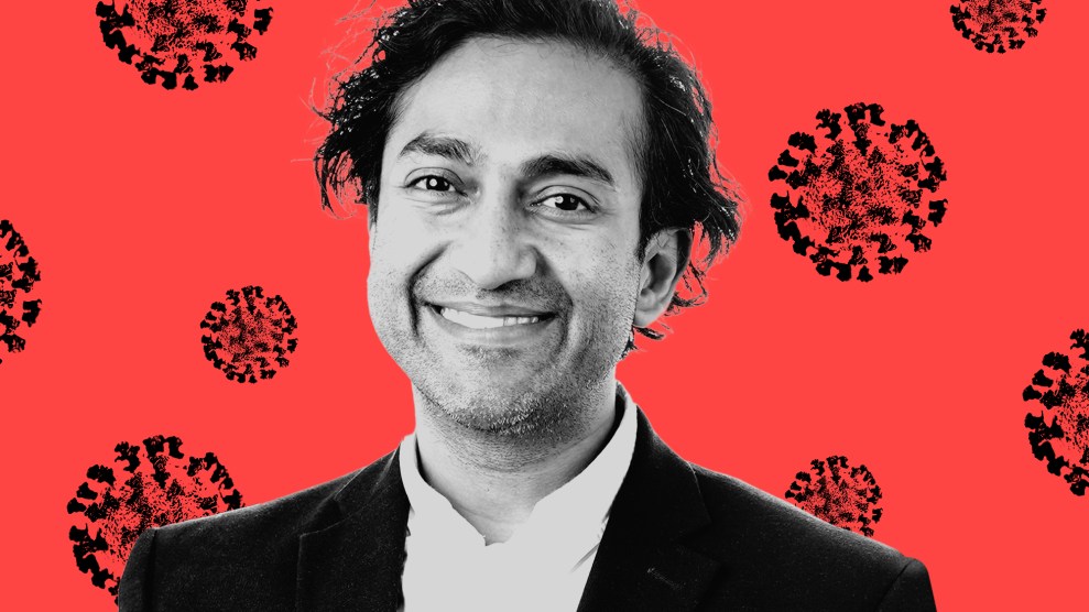 Portrait of Vinay Prasad, a smiling man, on a background with stylized COVID 19 virus strains behind him.