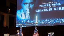House speaker Mike Johnson on stage, talking in front of a screen that reads "Washington D.C. Prayer Vigil for Charlie Kirk"