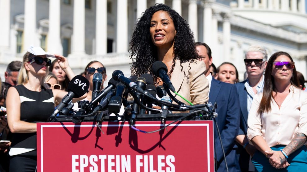 Lisa Phillips speaking into a microphone in front of the Capitol Building and a group of other Epstein survivors and their supporters on Wednesday.