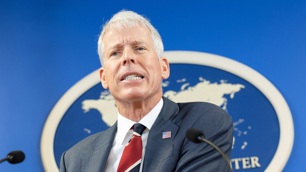 Chris Wright in front of a blue background