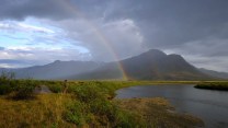 A double rainbow over a river
