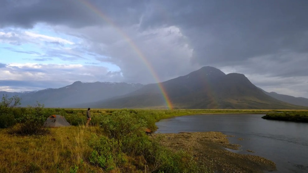 A double rainbow over a river