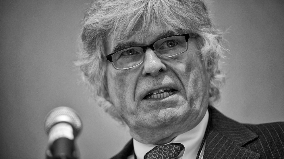 Peter Brimelow, man in suit wearing glasses.