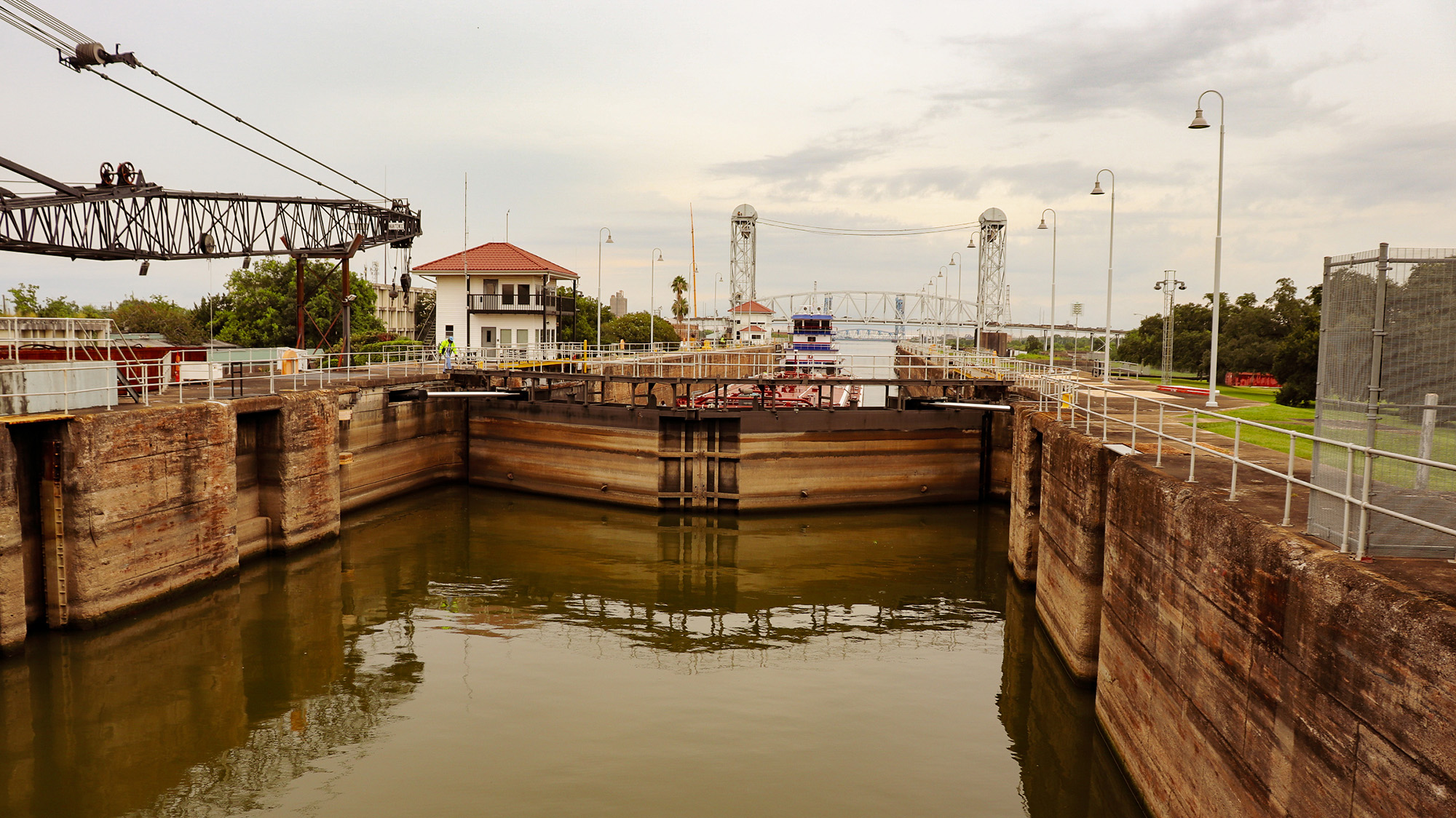 A barge waits in the lock of a canal.