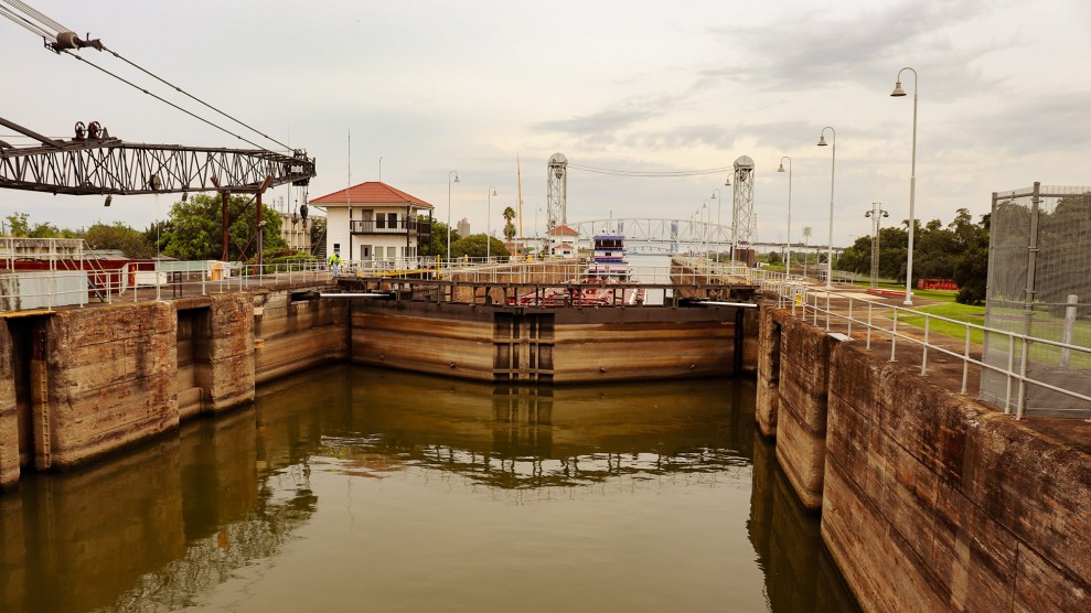 A barge waits in the lock of a canal.