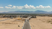An aerial shot of a construction site in desert land.