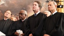Supreme Court justices Alito, Thomas, Kavanaugh, and Roberts stand side by side at Trump's 2024 inauguration.