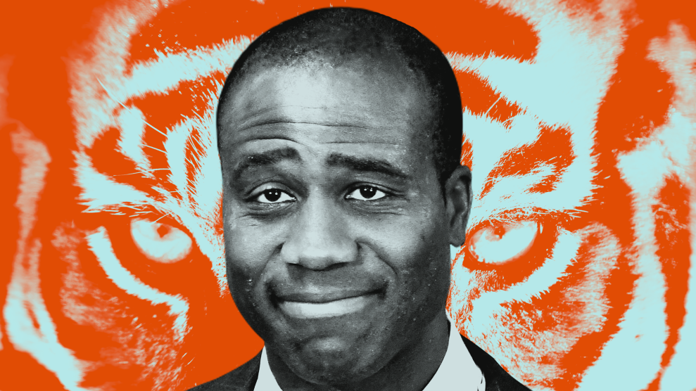 A photo illustration of a middle-aged African American man with a slight smile on his face with arched eyebrows. Behind his image is a close-up of the eyes of an orange and white tiger.