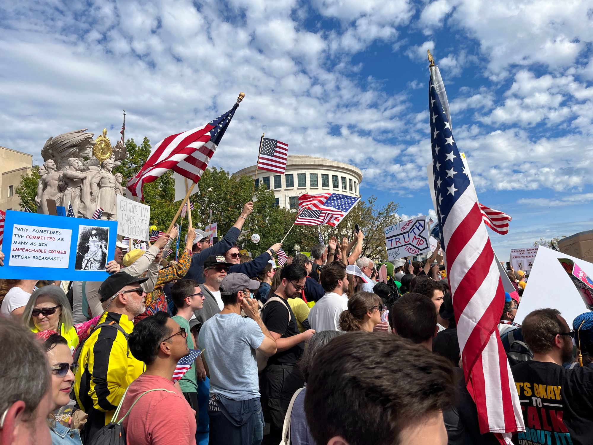 No Kings protesters wave flags