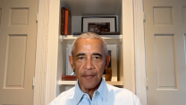Barack Obama wears a blue collared shirt, and speaks during a live stream.