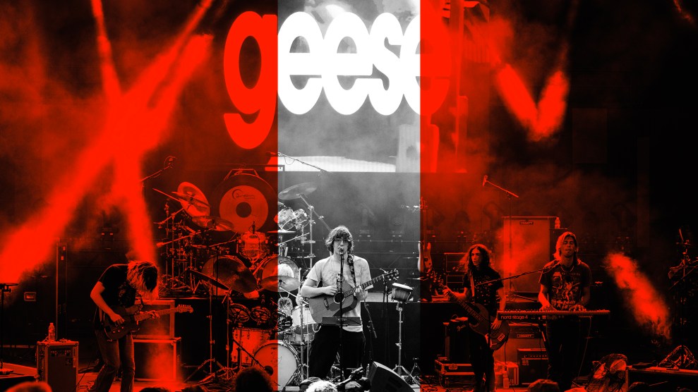 A black and white photo of the band Geese and 4 of its members playing onstage at a concert; overlaid on the photo is a red tint to the left and right.