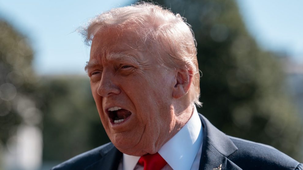 Trump speaking to reporters outdoors with his mouth open, mid-yell.