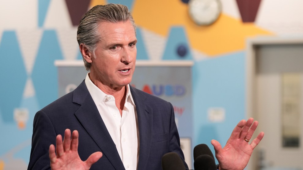 A white man gesticulates while talking.