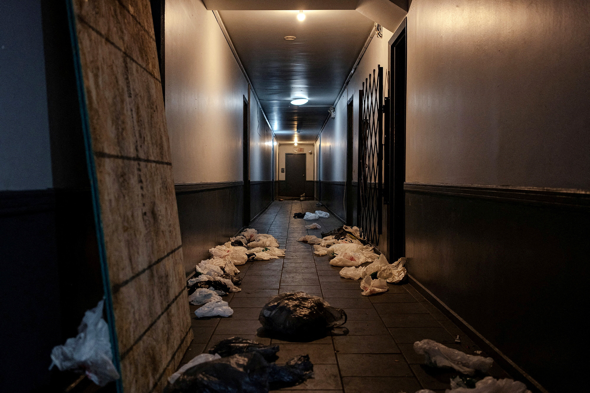 Personal items strew about an apartment hallway.