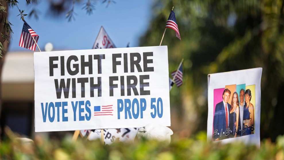Signs at a protest in Santa Barbara support Proposition 50 in California