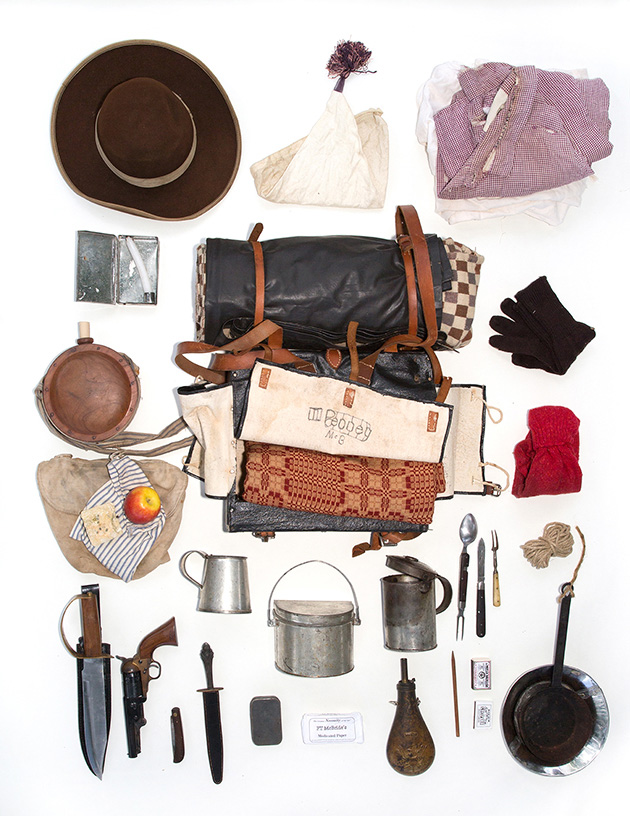 Phil is a Civil War Reenactor.  His bag contains the supplies a civilian in 1964 would carry to bug out.  It includes hardtack and an apple for food, cooking gear, wool blankets, and lye soap.