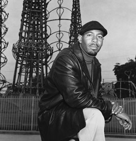 Aqeela Sherrills, gang member and street worker, in front of the Watts Towers