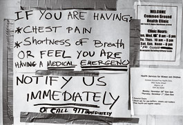 hand-written sign on the clinic door: 'If you are having chest pain, shortness of breath, or feel you are having a medical emergency, notify us immediately or call 911 immediately.'